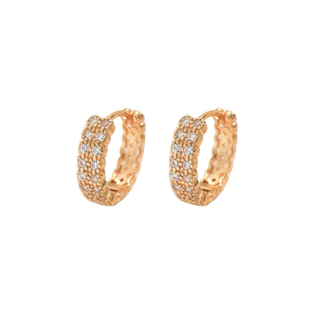 A pair of polished copper geometric ear studs featuring a thin ring with a small central dot on a white background.