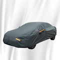 Grey PVC car cover for Volkswagen models shown fitted on a car, illustrating rainproof and sun protection design.