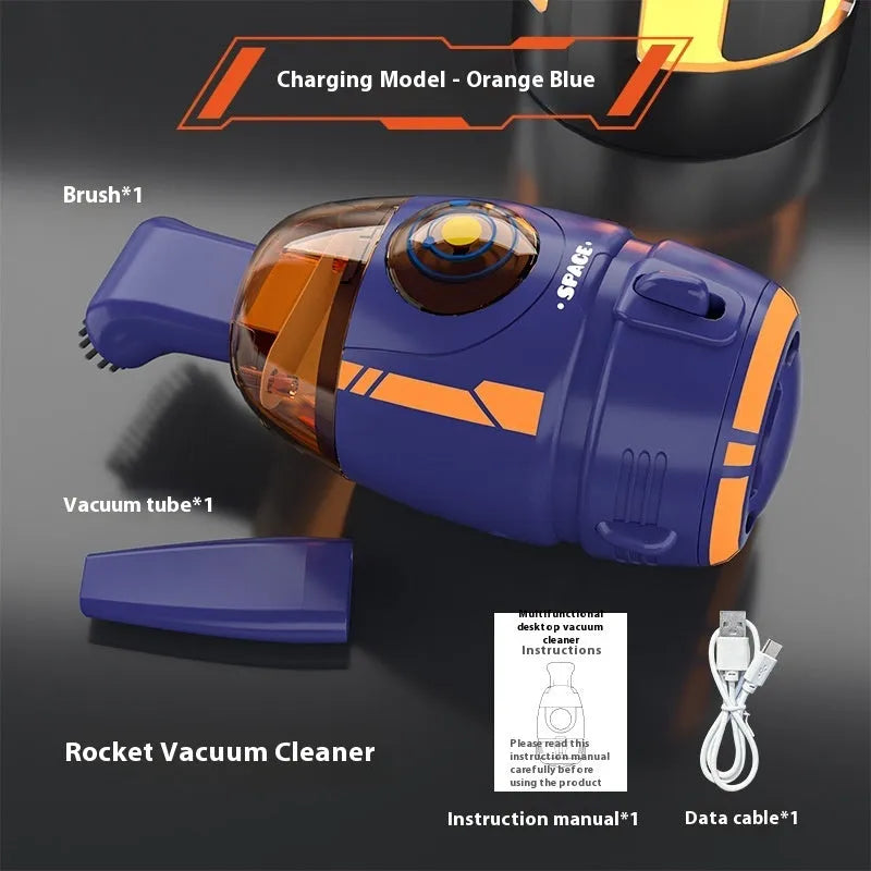 USB-powered handheld desktop vacuum cleaner in blue rocket design on a wooden desk.
