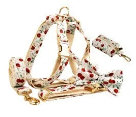 Red cherry printed dog collar and leash set with light gold buckle and bow on cloth material