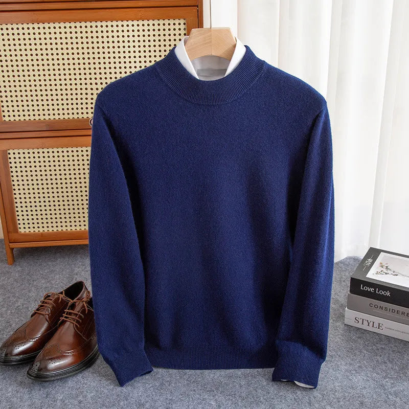 Man wearing a chunky knit half-turtleneck wool sweater in a loose fit.