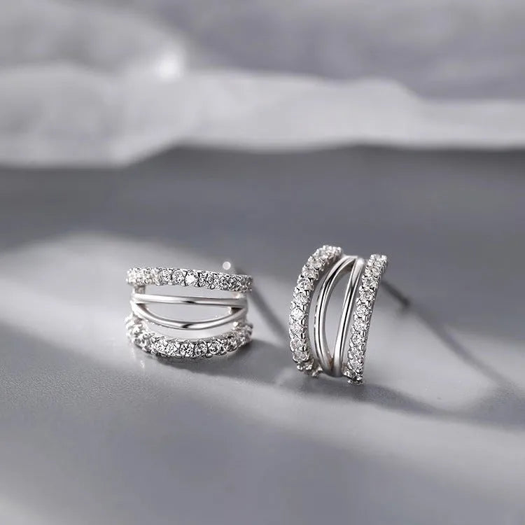 Geometric 925 silver stud earrings shown in three size options with silver needle posts