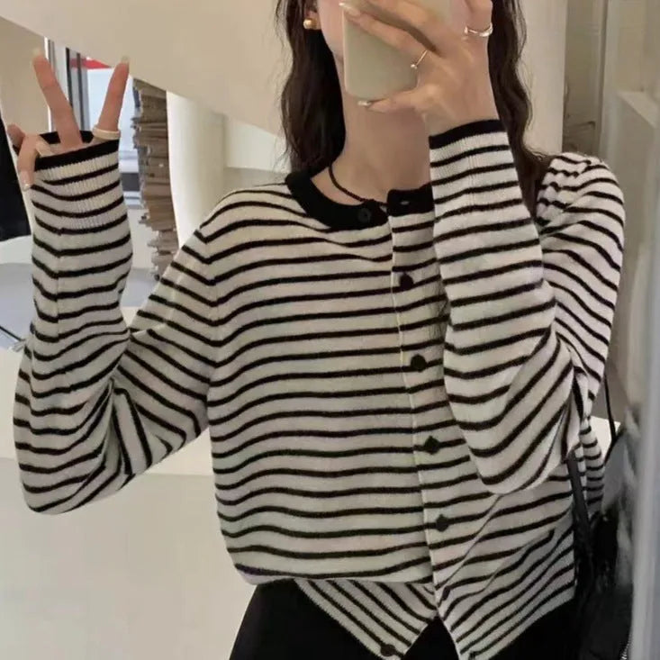 Dark grey and white striped women's cardigan coat with long sleeves and a short, slim fit.