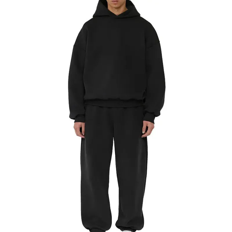 A man wearing a grey fleece-lined cotton pullover hoodie with a wool lining.