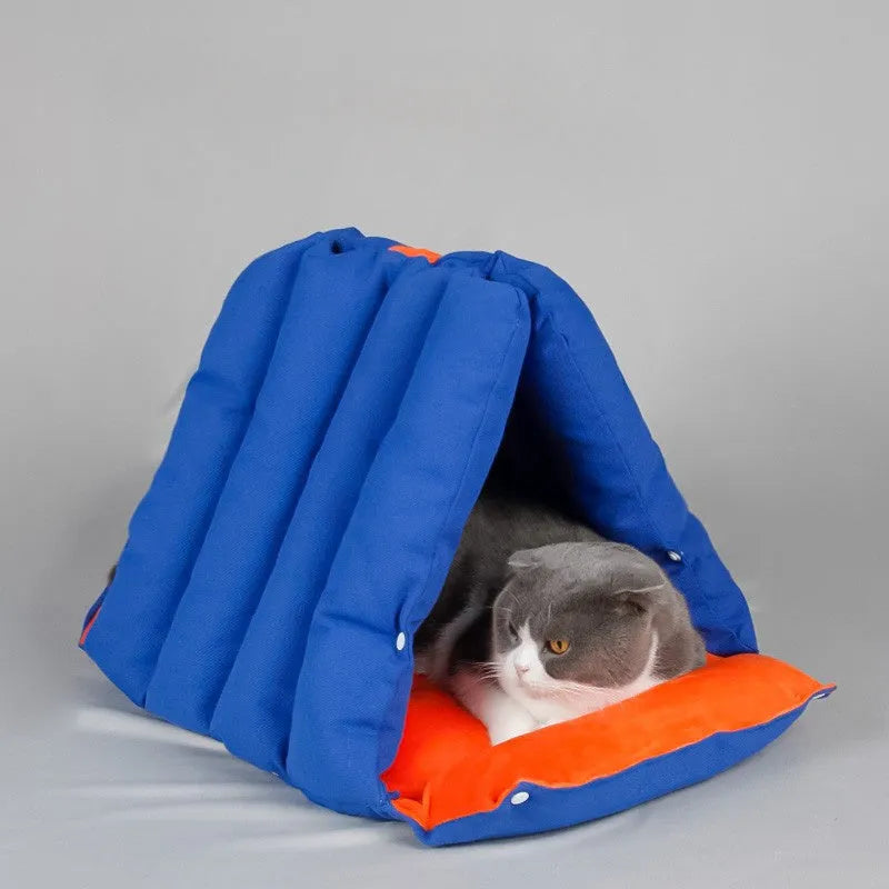 Blue triangular cotton cat bed with drilled holes for stacking, measuring 45x38x38cm