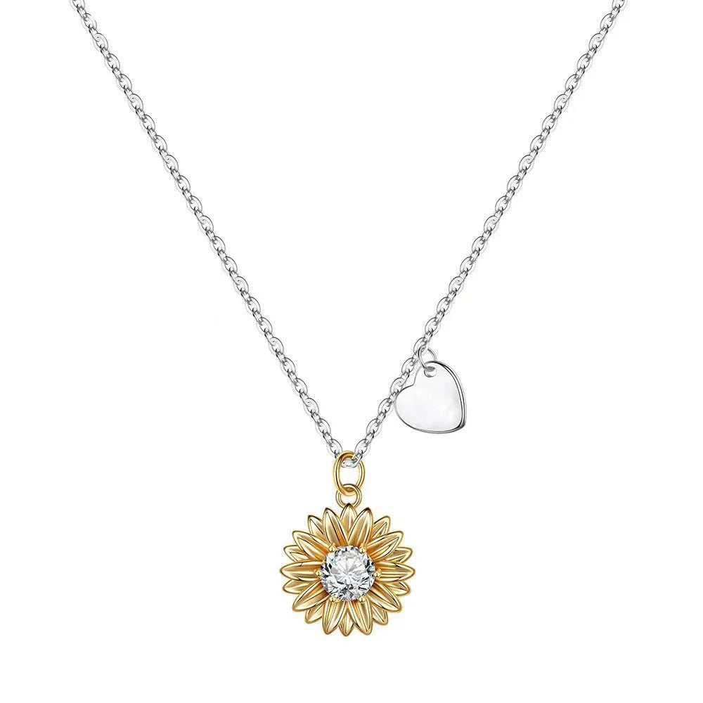 925 silver sunflower necklace with adjustable cross chain and daisy pendant on a model.
