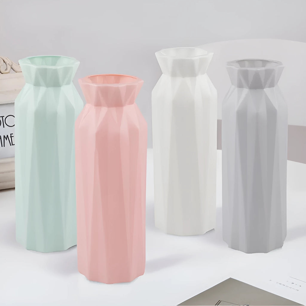 Green plastic melamine vase with a wide, stable base on a wooden surface.