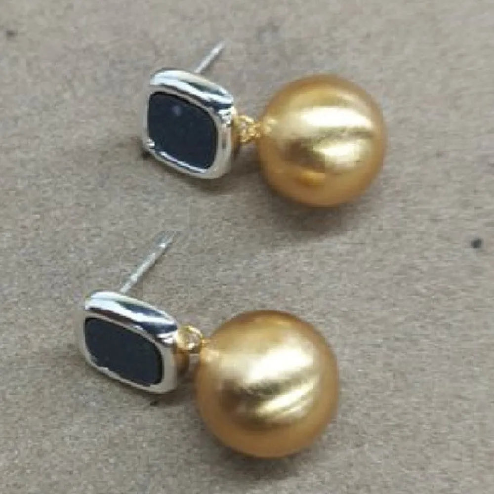 Women's copper matte geometric square round stud earrings in gold silver colour on neutral background