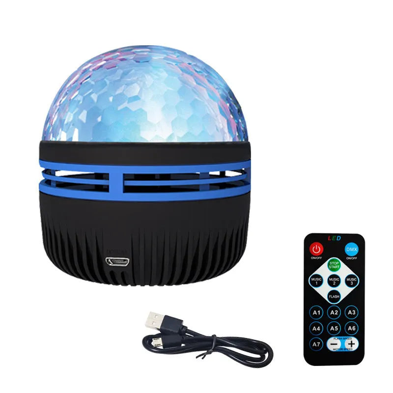 LED star galaxy projector lamp with colourful rotating light on a dark surface