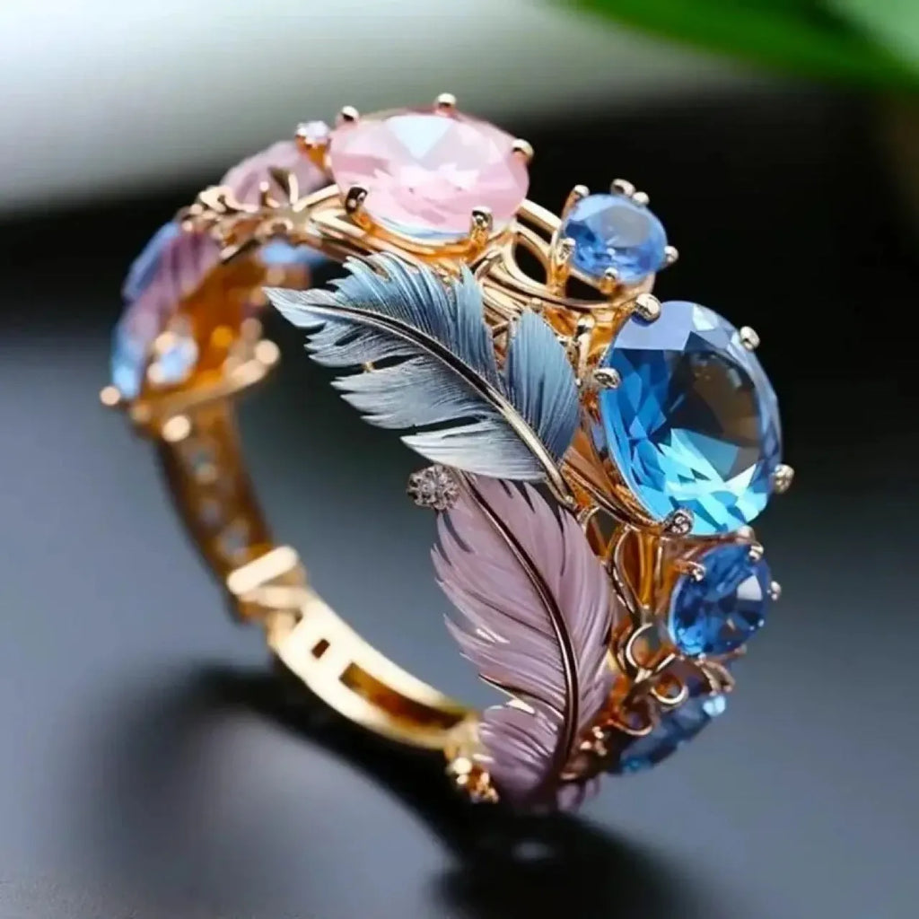Gold geometric brass ring with colourful embossed feather design and zircon inlay