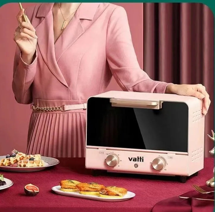 Pink home kitchen electric oven with up and down heating, 4-5 person capacity, 260x205x171mm, on countertop