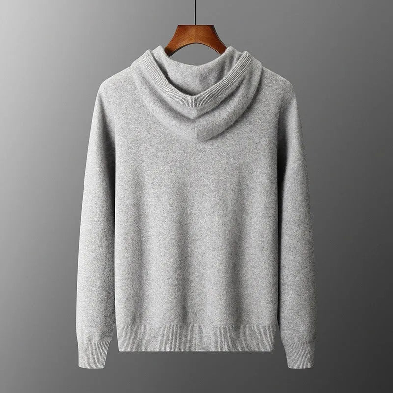 Men's dark grey cashmere hoodie and matching trousers laid out as a complete casual set.