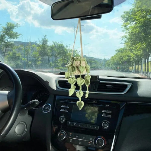 Green and white fish-scale style knitted wool car hanging planter with 8cm base and long white cord.
