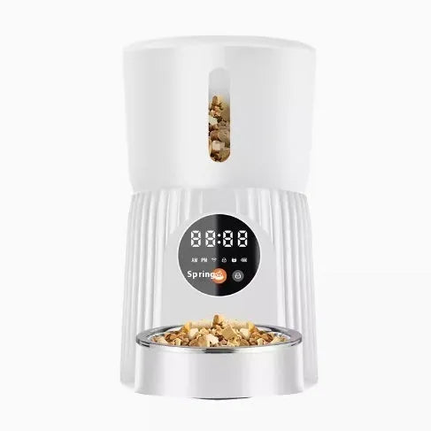 Black automatic pet feeder with digital timer display and food hopper.