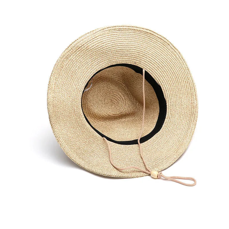Men's foldable straw sun hat with wide brim in mixed beige colour showing portable design