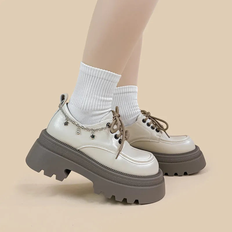 White women's platform Mary Jane shoes with chunky heel and XINGX bear design on round toe
