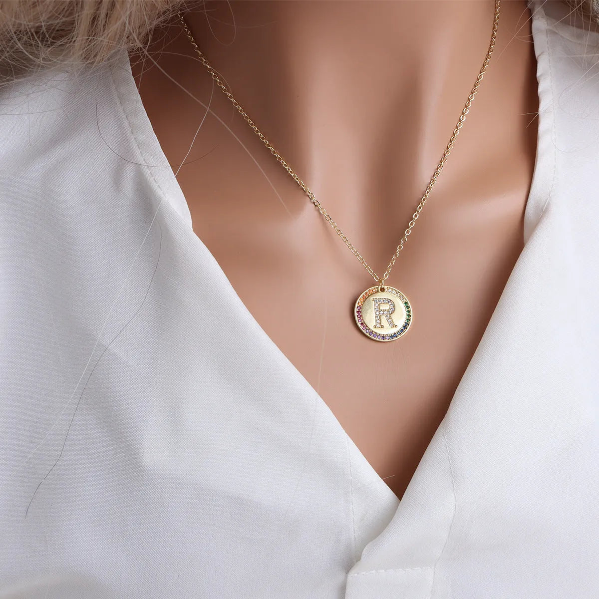 Gold English letter round pendant necklace with colourful crystals on clavicle length chain