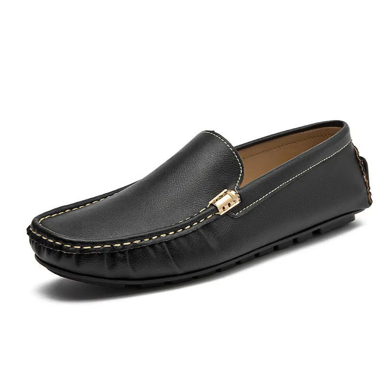 Men's driving shoes in black with matte leather finish, round toe, and flat wedge heel