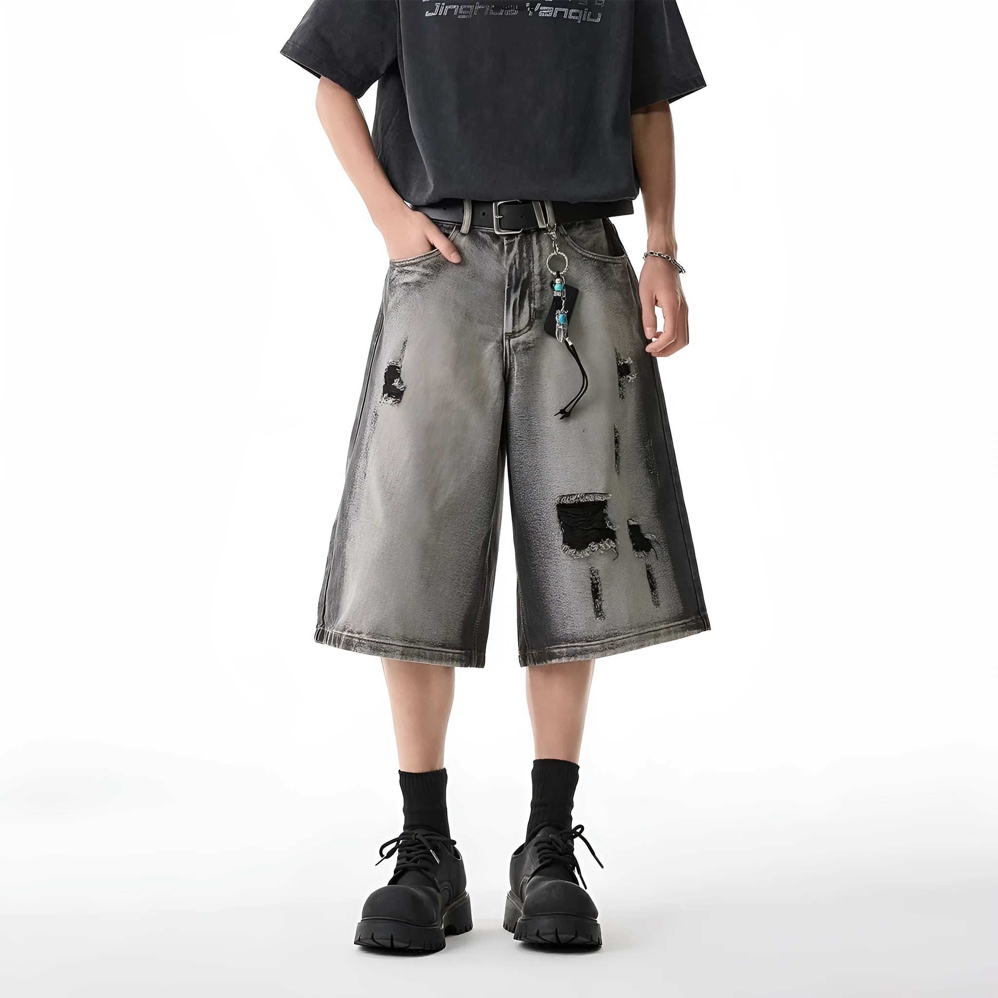 Grey water washed denim shorts with hole detailing and loose retro fit