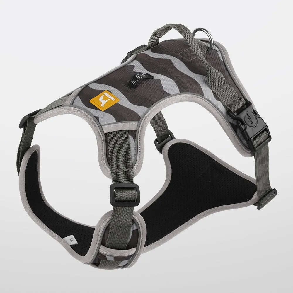 Reflective orange dog harness with chest and back rope attachments and a hand-holding lead.