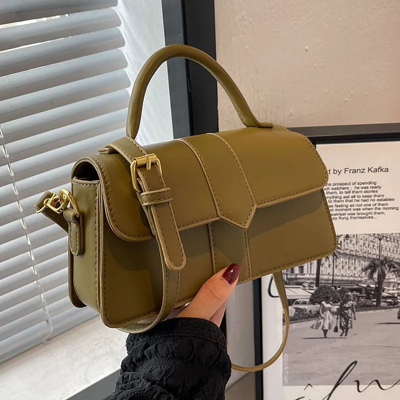 Beige women's horizontal square messenger bag with sandwich pocket and file organiser interior.
