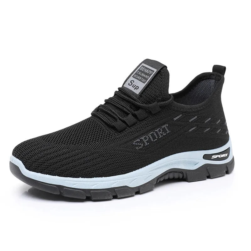 Low-top casual sneaker with round toe and PVC sole in black, shown on a white background.