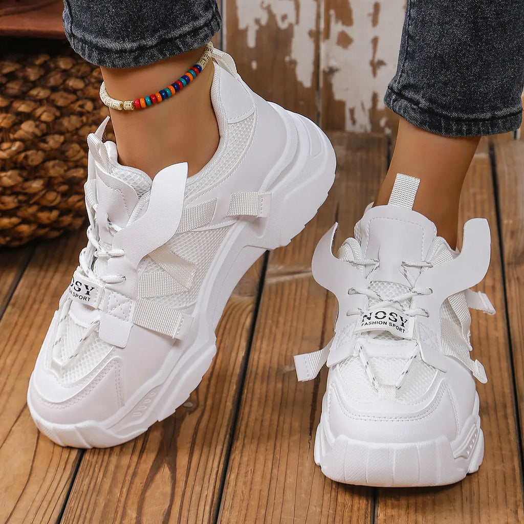 Women's purple green white pink yellow mesh platform sneakers with lace-up front and animal pattern.