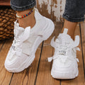 Women's purple green white pink yellow mesh platform sneakers with lace-up front and animal pattern.