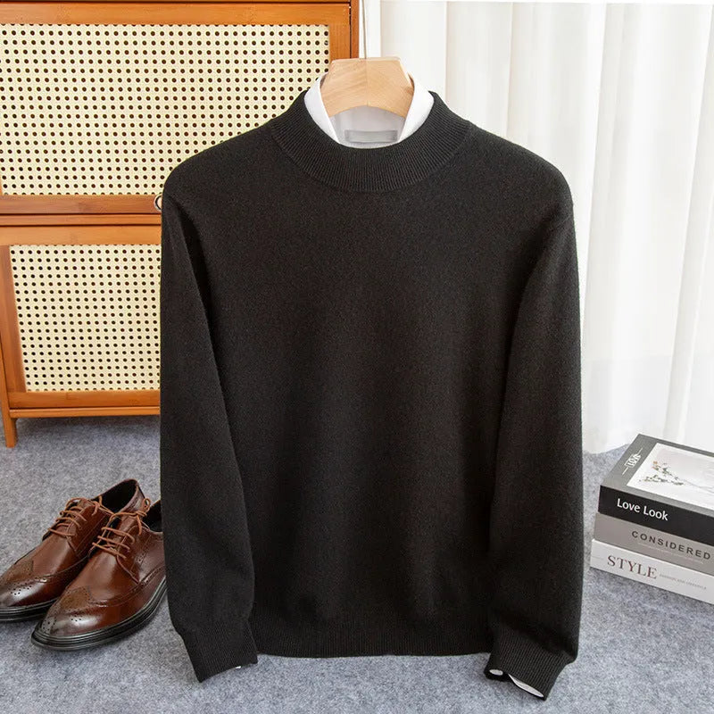 Man wearing a chunky knit half-turtleneck wool sweater in a loose fit.