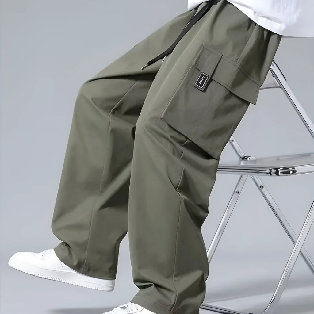 Boys cargo pants with multiple large pockets and drawstring waist in straight leg fit