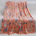 A soft flannel blanket with a cartoon print, shown in two sizes for a child's cot or pram.
