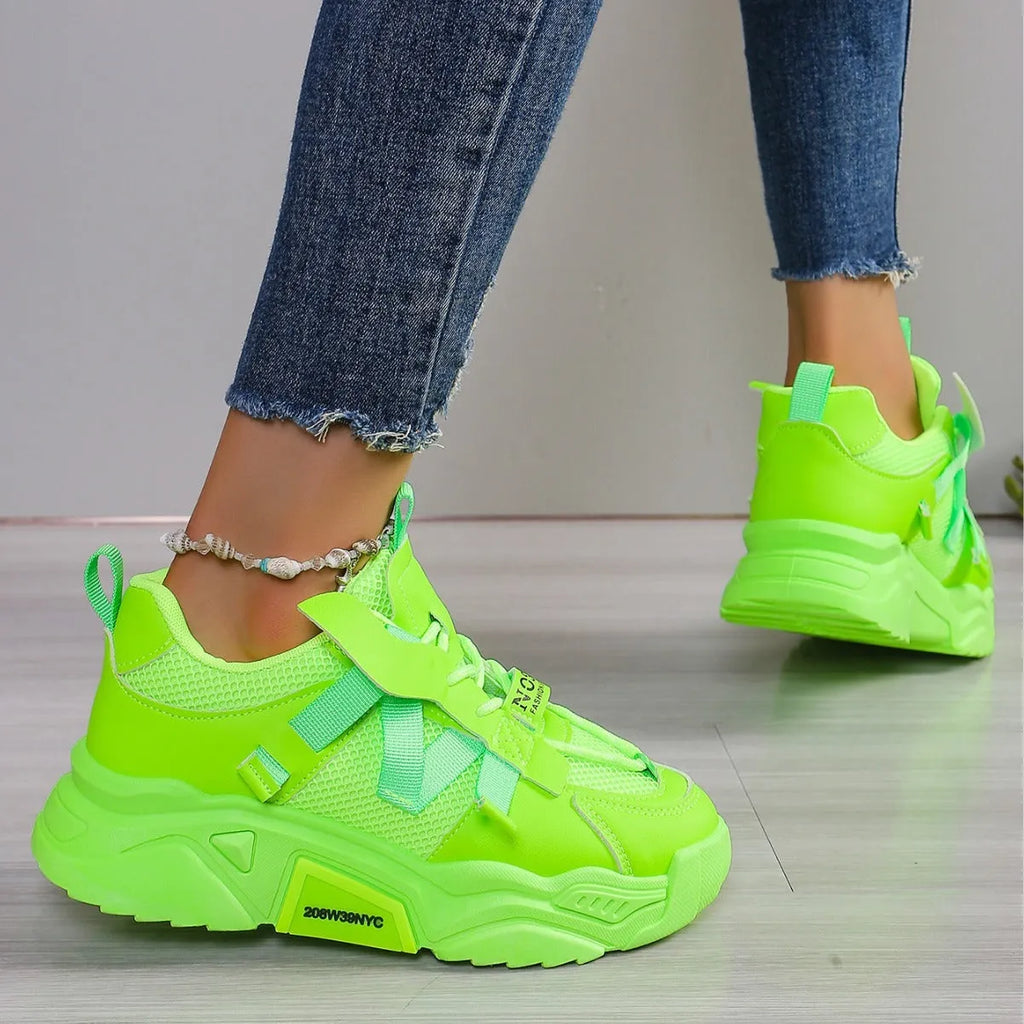 Women's purple green white pink yellow mesh platform sneakers with lace-up front and animal pattern.