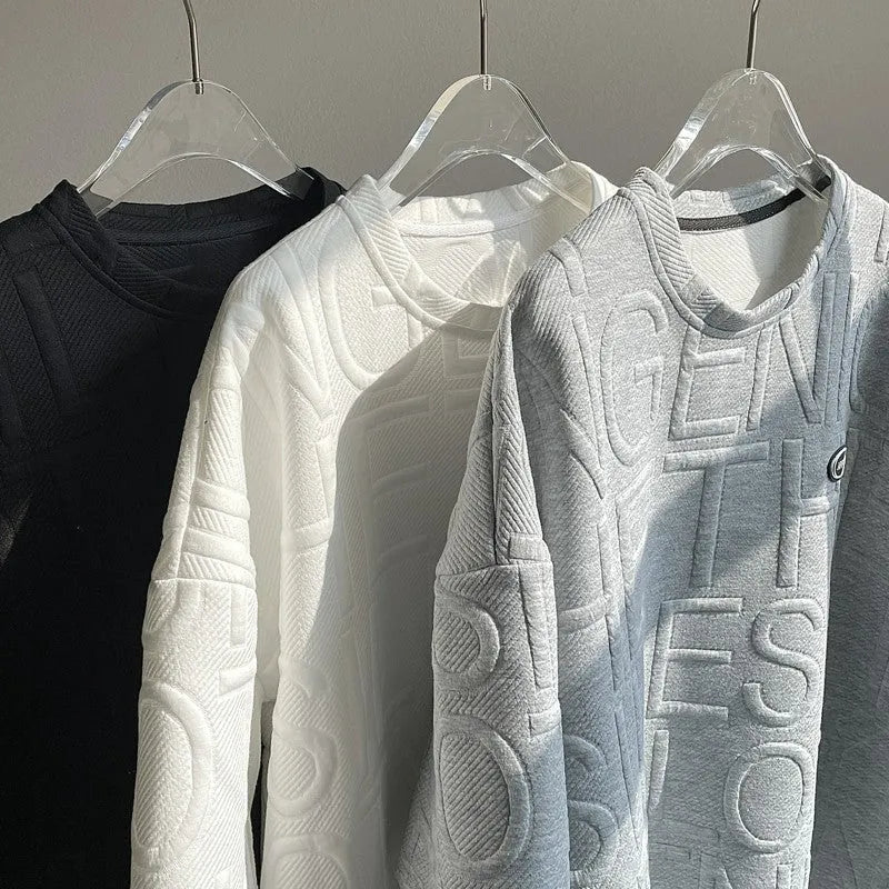 Men's grey loose-fit t-shirt with a raised retro letter print on the chest.