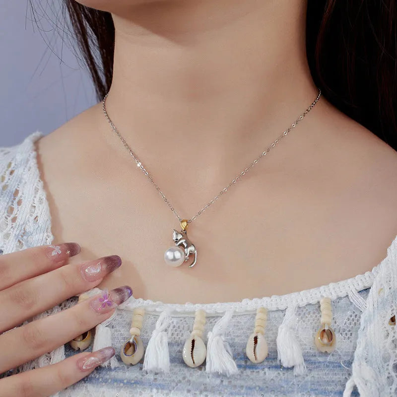 925 sterling silver clavicle necklace with a cat charm pendant on a model.