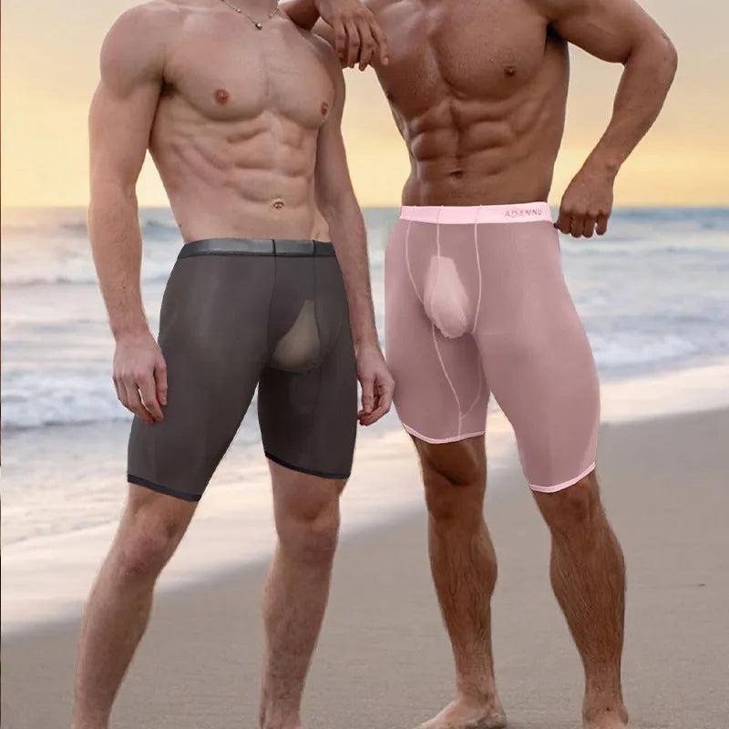 Men's solid colour mesh shorts in knitted nylon fabric, shown in black, white, and pink.