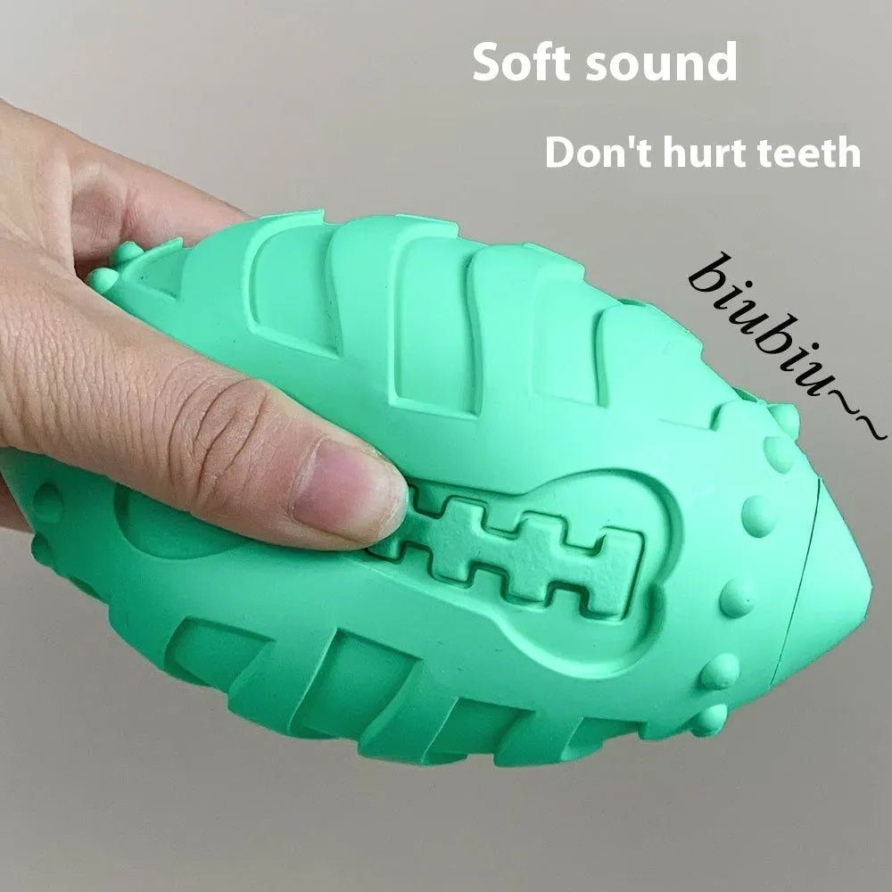 Thickened rubber rugby ball dog toy with squeaker in light green or sapphire blue colour