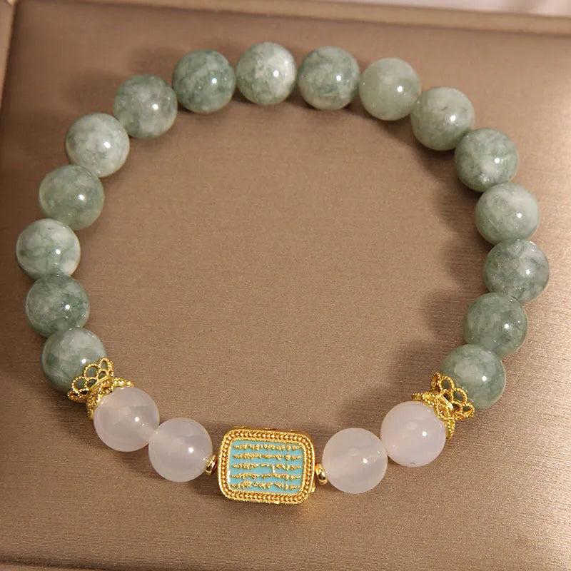 Women's oil green emerald crystal bracelet showing five engraved scripture sections