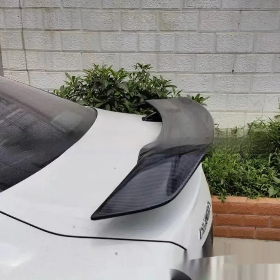 Universal punch-free car spoiler tail wing in ABS plastic, shown in bright black finish.