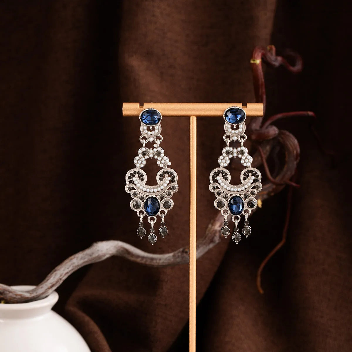 Vintage court style earrings in blue crystal with geometric chamfered square grain shape, zinc alloy and electroplated finish