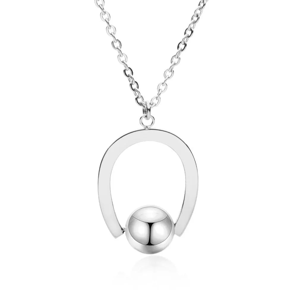 Gold and silver stainless steel necklace with geometric pendant on a cross chain, adjustable length.