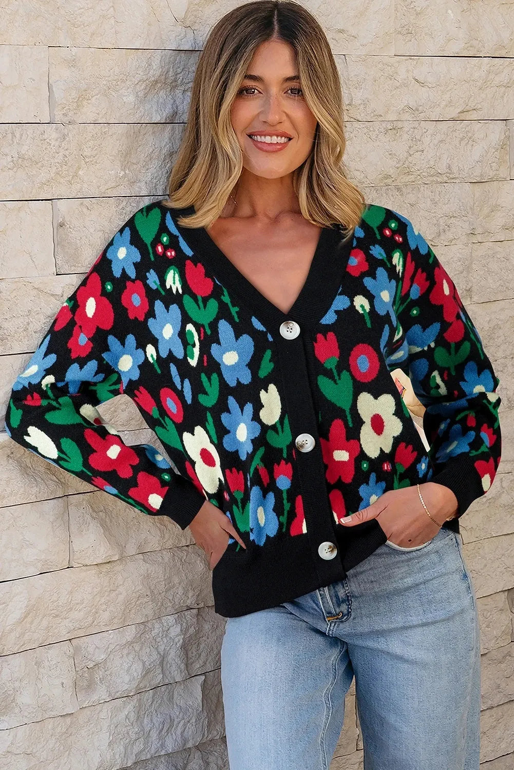 Black floral print V-neck button short cardigan sweater on model, long sleeves, shift silhouette