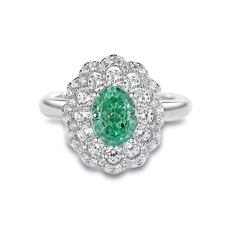 S925 sterling silver women's ring with ellipse emerald and inlaid high carbon diamond in geometric setting.