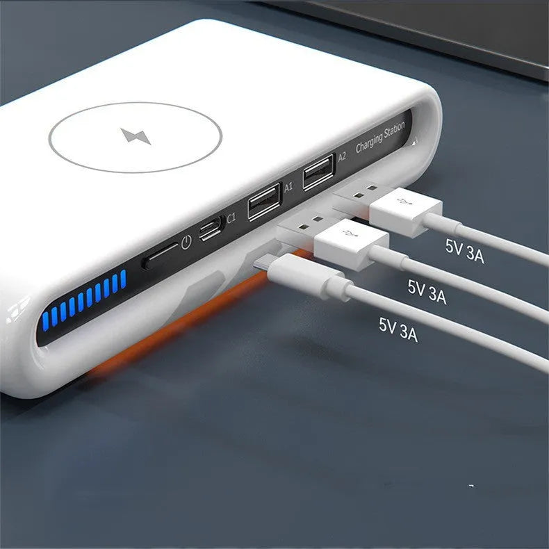 White desktop wireless charger with atmospheric lighting and phone charging on surface