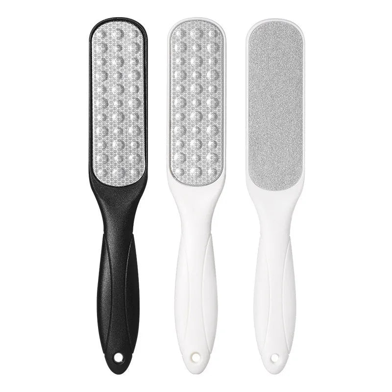 Stainless steel foot file with handle and two double-sided sandpaper pads for callus removal.