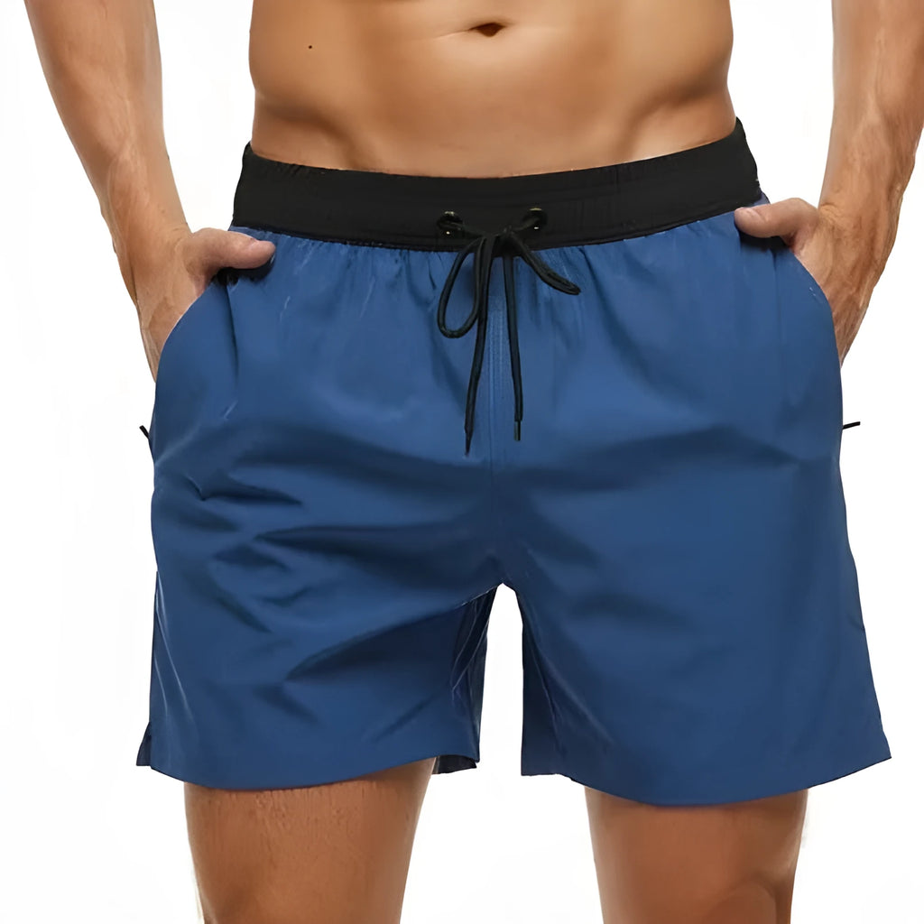 Men's blue drawstring athletic shorts with contrast stitching on the waistband and side pockets.
