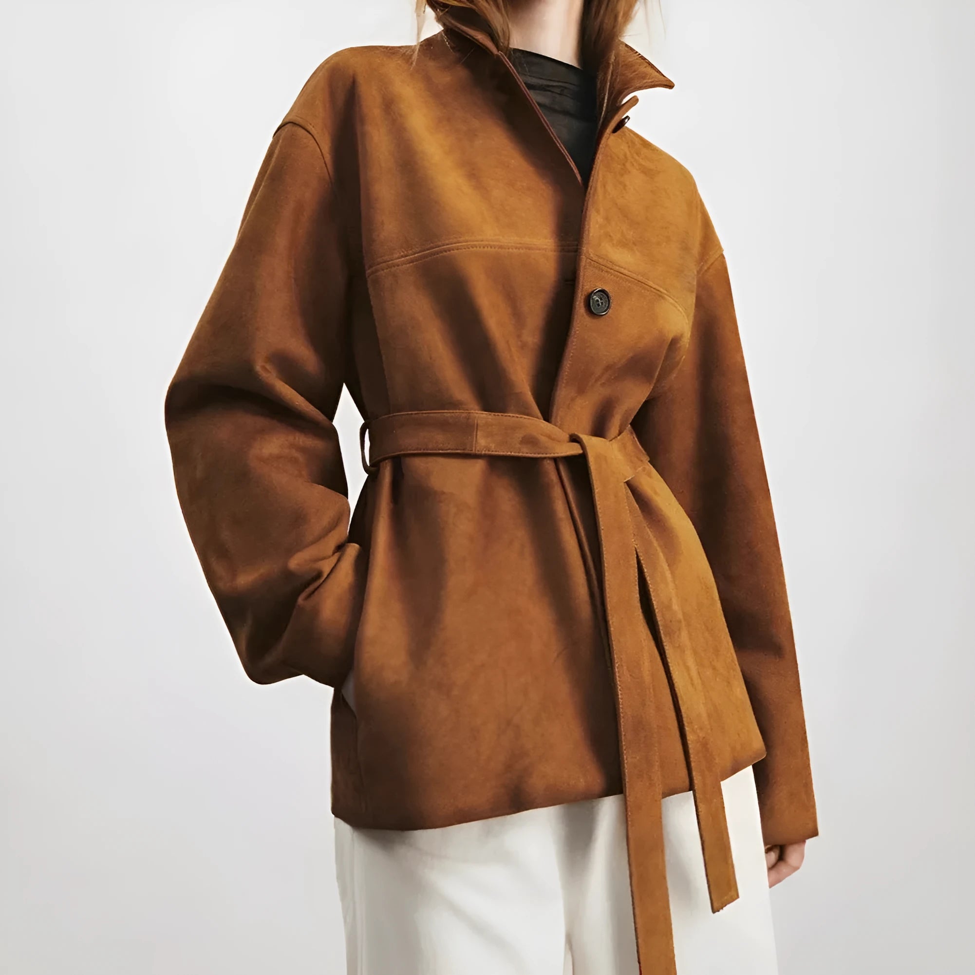 Yellow brown loose-fit cashmere coat with a leather-stitched Peter Pan collar and an attached waist belt.