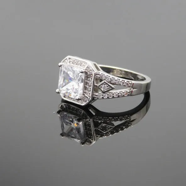 Geometric women's zircon ring with hollow design and platinum-colour finish shown from multiple angles