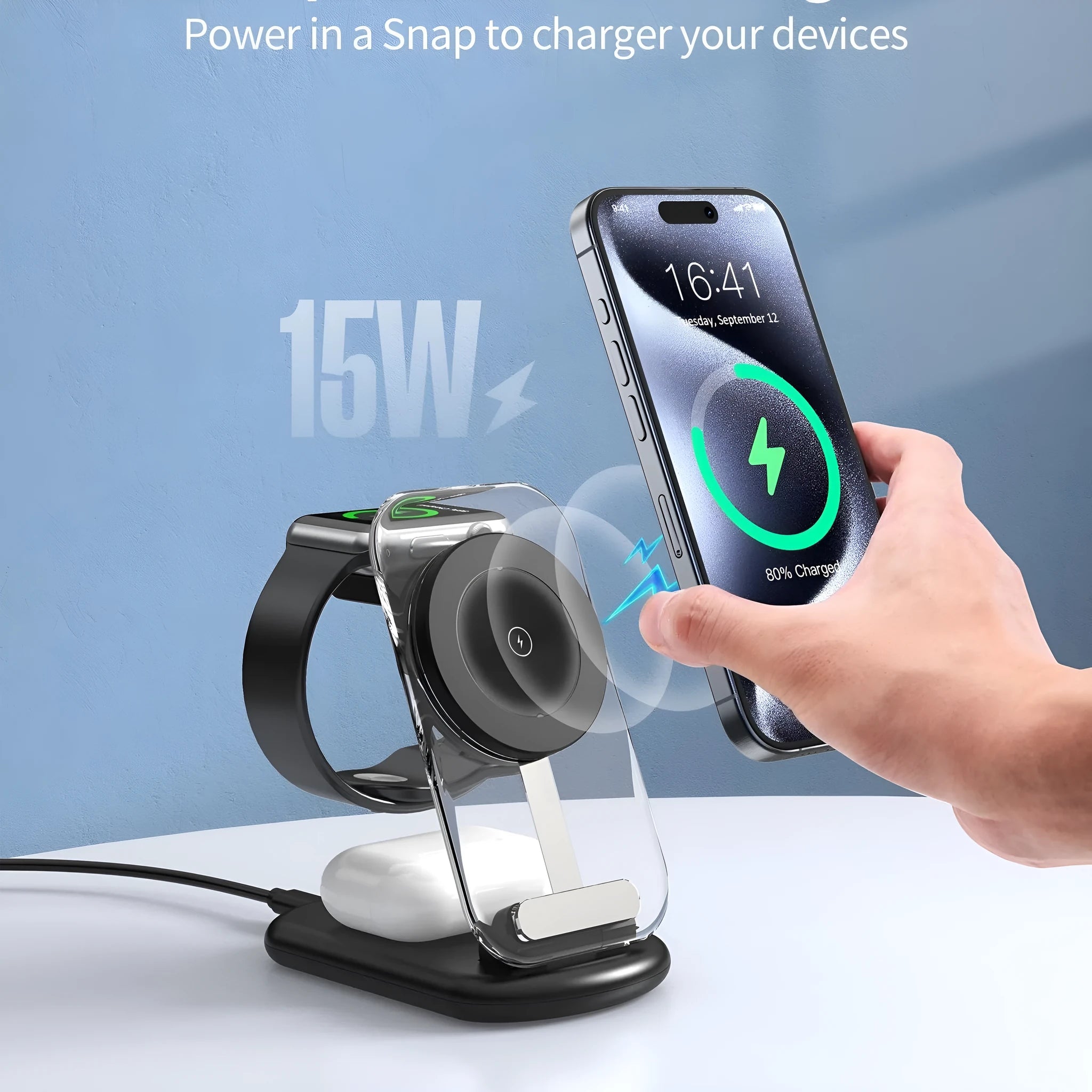 Transparent folding magnetic wireless charger showing internal components, charging an iPhone and AirPods case on a desk.