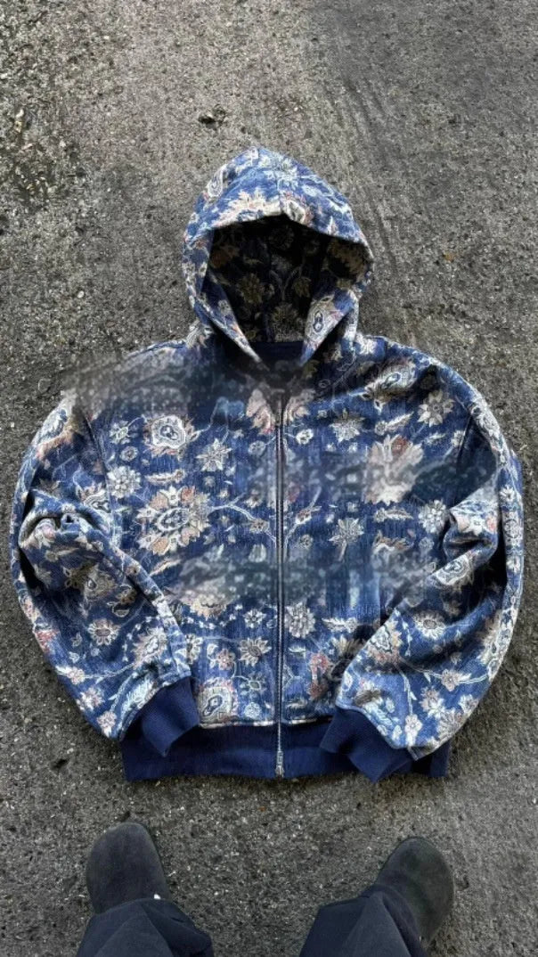 Man wearing a blue loose-fit zip hooded coat with the hood up, showcasing casual autumn style.