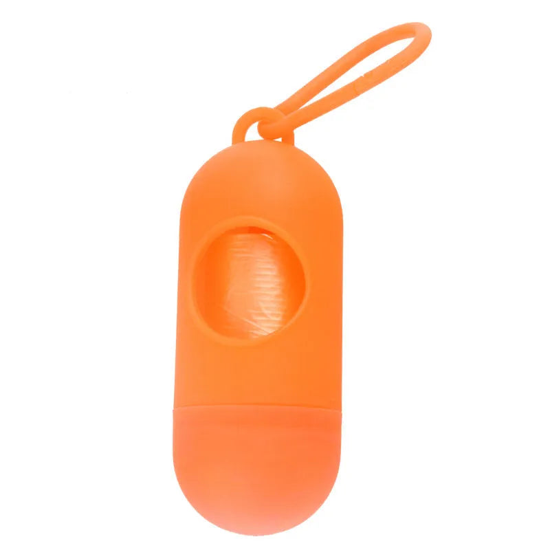 Small, lightweight dog poop bag holder showing side hook and Velcro strap for attachment.